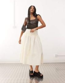 Reclaimed Vintage full midi skirt with dropped hem ruffle waist in cream at ASOS