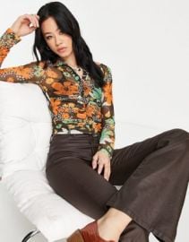Reclaimed Vintage inspired mesh ruched shirt in retro floral print at ASOS