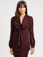 Regina's brown blouse at Saks Fifth Avenue