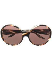 Round frame sunglasses by Gucci at Farfetch