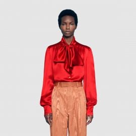 Satin shirt with neck bow at Gucci