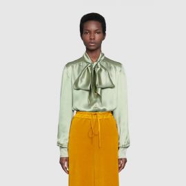 Satin shirt with neck bow at Gucci