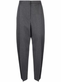 Shop Alexander McQueen tapered-leg trousers with Express Delivery - at Farfetch