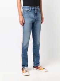 Shop Palm Angels side-stripe straight-leg jeans with Express Delivery - at Farfetch