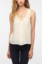 Similar white sleeveless top at Urban Outfitters