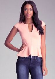 Split neck peplum top at Bebe