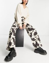 Stradivarius STR printed jeans in cow print at ASOS