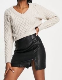 Stradivarius faux leather split detail mini skirt in black at ASOS