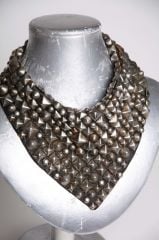 Studded leather bib at Nicolina Royale