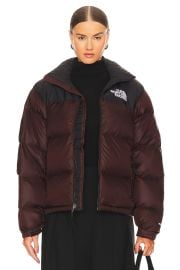 The North Face 1996 Retro Nuptse Jacket in Coal Brown Tnf Black at Revolve