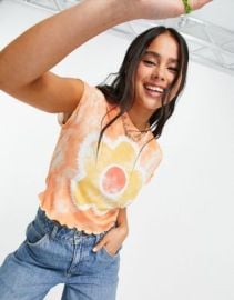 The Ragged Priest shrunken t-shirt with daisy print in bright tie dye at ASOS