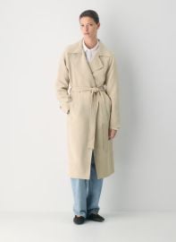 The Splendor Trench Coat in Marcona Beige at Aritzia