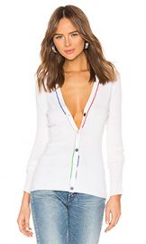 WornOnTV: Macy’s white cardigan with multi color buttons and green ...