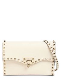 Valentino Garavani Small Rockstud grained leather bag at Luisaviaroma