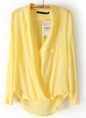 Yellow cross dipped hem blouse at She Inside