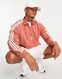 adidas Originals Adicolor 3 stripe long sleeve 12 zip polo in orange at ASOS