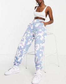 adidas Originals sweatpants in blue with flower print at ASOS