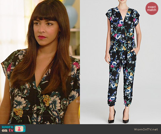 Aqua Night Floral Cap Sleeve Crossover Neck Jumpsuit worn by Hannah Simone on New Girl