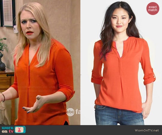 Pleione Mixed Media Tunic in Orange worn by  Melanie Burke (Melissa Joan Hart) on Melissa and Joey