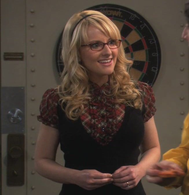Bernadette's red plaid ruffle shirt with black vest on The Big Bang Theory