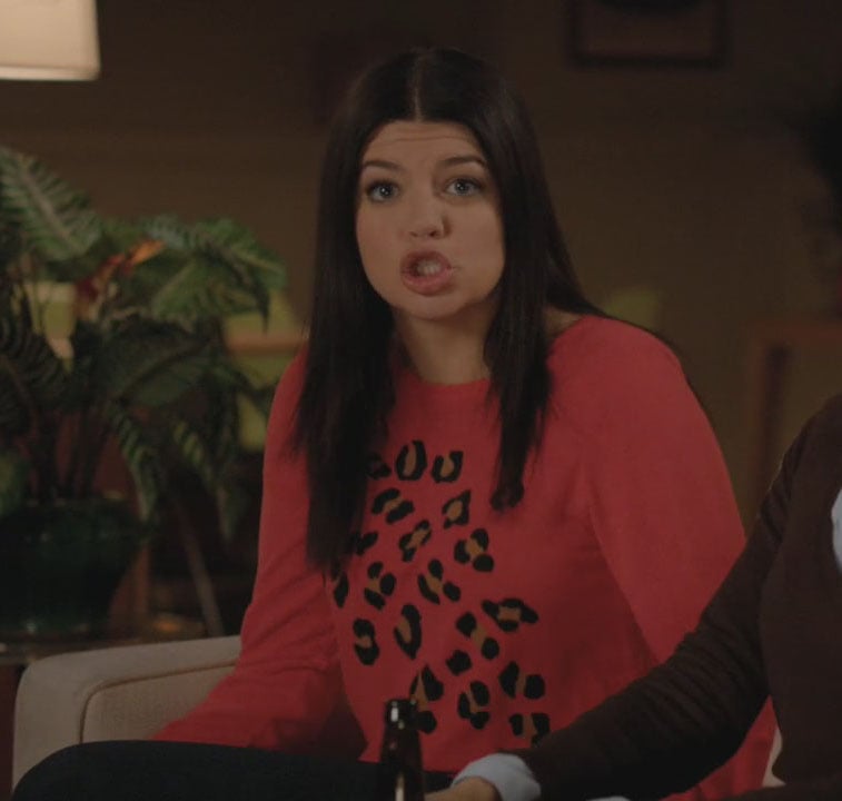 Penny's orange sweater with leopard spots on Happy Endings