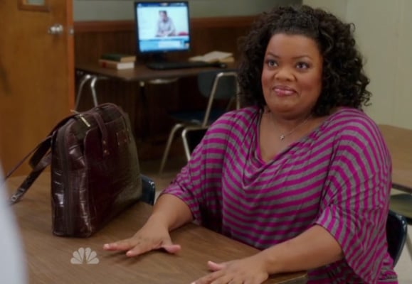 Shirley's pink striped top and leather handbag on Community