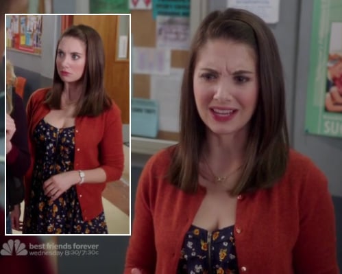 Annie's black floral dress and orange cardigan on Community