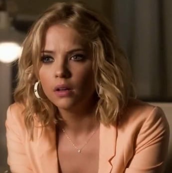 Hanna's peach blazer and studded hoop earrings on Pretty Little Liars
