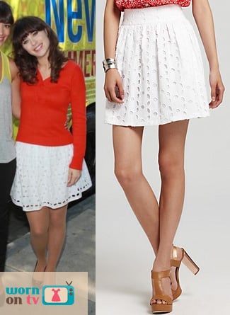 Jess's white eyelet skirt and red button-back sweater on New Girl