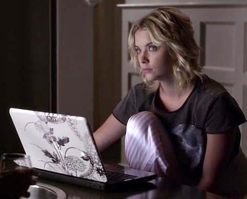 Hanna's grey cropped unicorn top and pink striped pajama pants on Pretty Little Liars