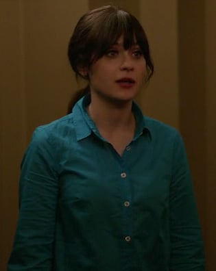 Jess's bright blue collared shirt with white buttons on New Girl