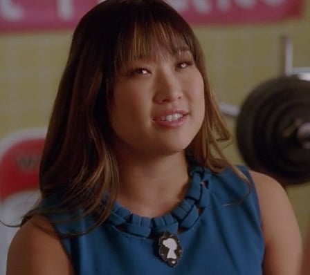 Tina's blue shift dress with black and white brooch on Glee