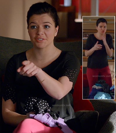Penny's black top with eyelet sleeves and red jeans on Happy Endings