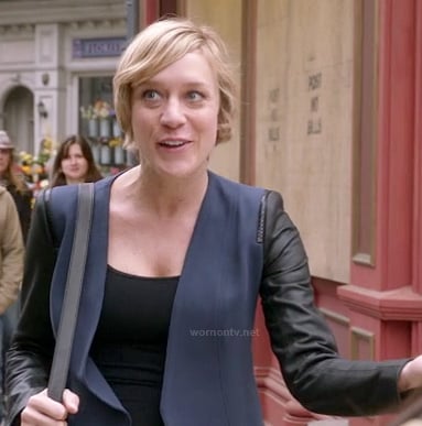 Christina (Chloe Sevigny)'s navy blazer with leather sleeves on The Mindy Project