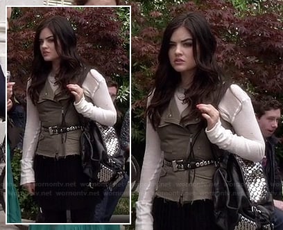 Aria's khaki vest with pleated skirt and studded backpack on Pretty Little Liars