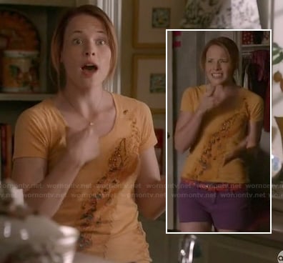 Daphne's orange peacock tee and purple shorts on Switched at Birth