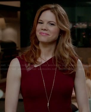 Peri's burgundy red dress with leather detail and asymmetric neckline on Devious Maids