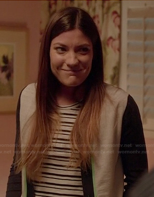 Debra's white and navy contrast sleeve cardigan with neon green detail on Dexter