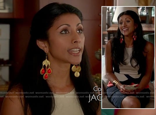 Divya's white, black and orange colorblock peplum top on Royal Pains