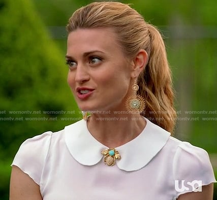 Paige's white peter pan collar top and bug brooch on Royal Pains