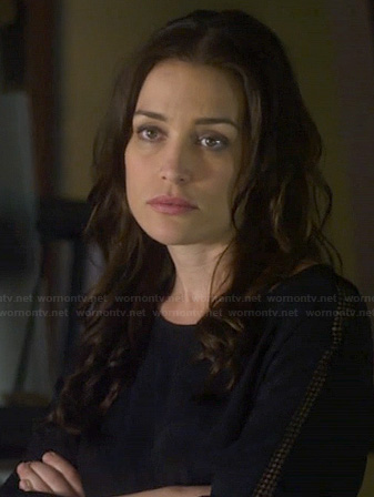 Annie's black top with perforated sleeve panels on Covert Affairs