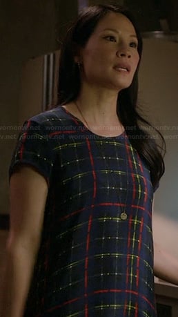 Joan's blue and neon check print dress on Elementary