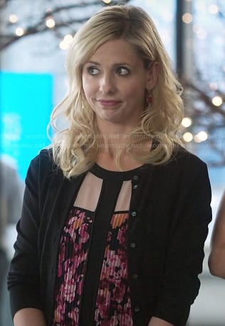 Sydney's pink and black pleated floral blouse on The Crazy Ones