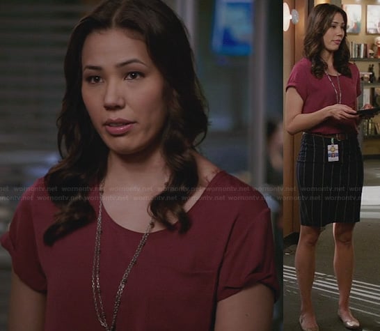 Angela's burgundy top and vertical striped skirt on Bones