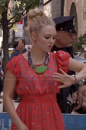 Carrie's red printed dress and green statement necklace on The Carrie Diaries