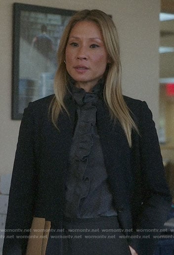 Joan's black coat with leather collar on Elementary