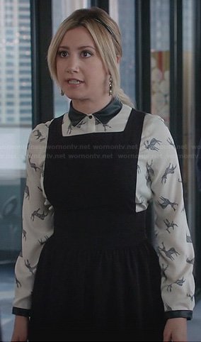 Kelsi's (Ashley Tisdale) deer print top with leather collar and pinafore dress on The Crazy Ones