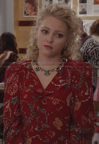 Carrie's red printed jacket and green flower necklace on The Carrie Diaries
