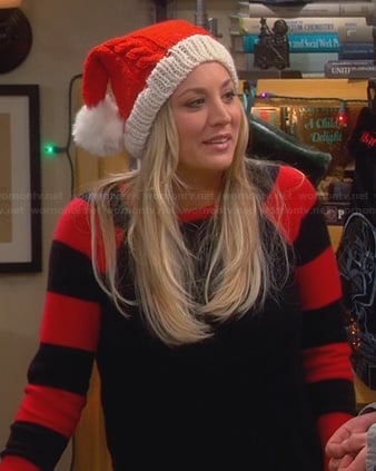 Penny's black sweater with red striped sleeves and knitted Santa hat on The Big Bang Theory