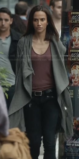 Tess's long green jacket and black zip pocket jeans on Beauty and the Beast